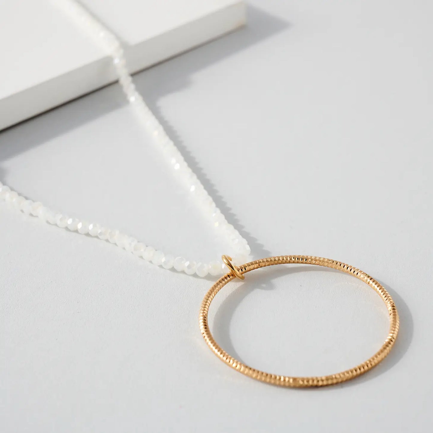 White Beaded Circle Necklace.
