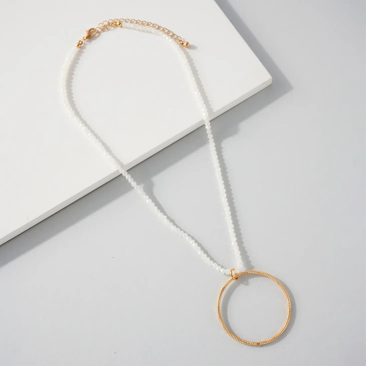 White Beaded Circle Necklace.